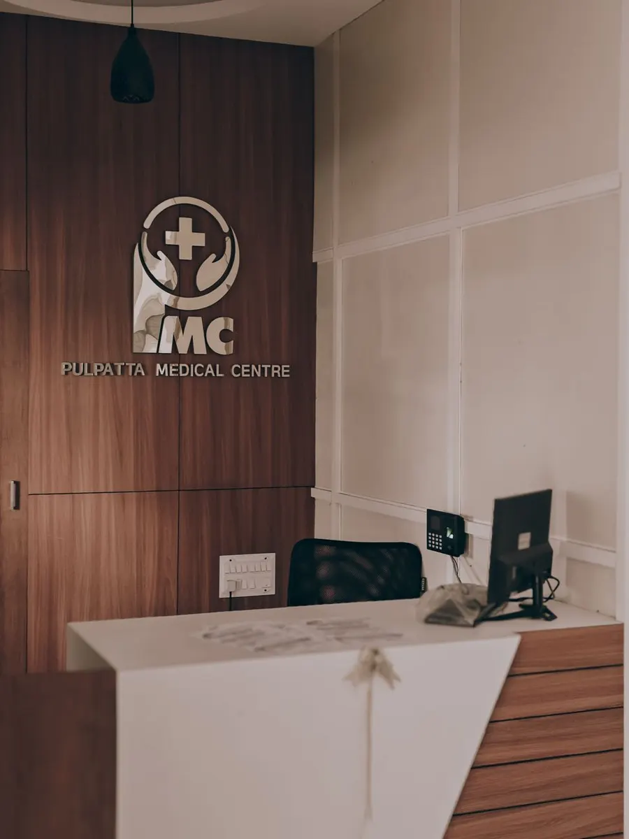 Warm and inviting medical center reception showcasing contemporary design with wood panel accents.